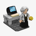 Catherine Langford minifigure at a desk with a computer, mini build from the Stargate 1994 Advent Calendar